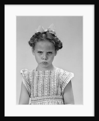 1940s little girl looking sad pouting frowning looking at camera by Anonymous