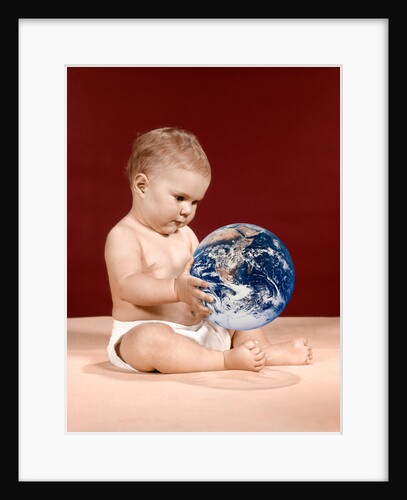 1960s symbolic ecology serious baby wearing cloth diapers sitting holding looking at the earth by Anonymous