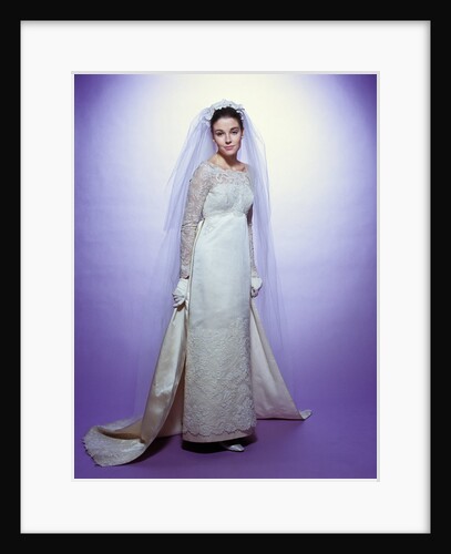 1960s young woman bride portrait bridal veil empire waist gown lace bodice hem full length by Anonymous