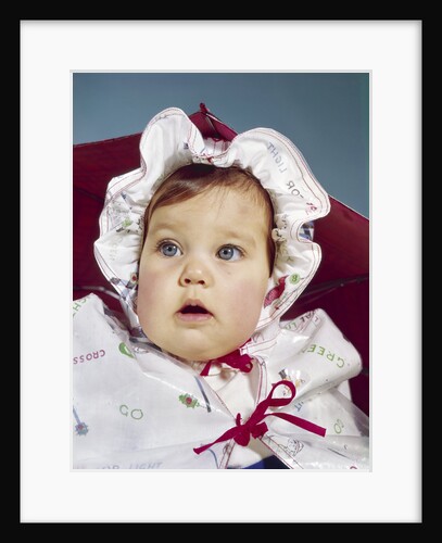 1960s baby wearing raincoat and hat by Anonymous