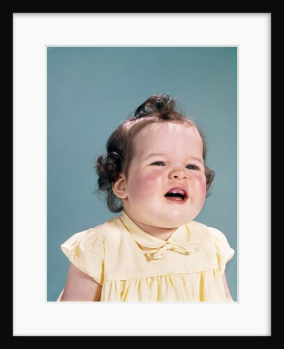 1960s smiling baby open mouth showing two new teeth gums teething by Anonymous