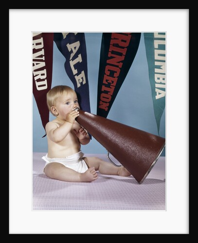 1960s baby shouting into cheerleader megaphone college pennants in background by Anonymous