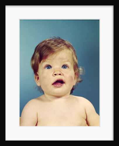 1960s portrait baby with uncertain inquisitive facial expression by Anonymous
