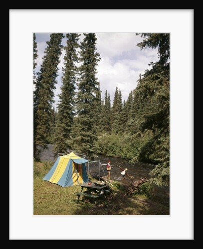 1970s couple man woman fishing in stream campsite with tent by Anonymous
