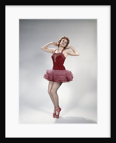 1960s teen girl woman red velvet costume pink net tutu fishnet stockings dance pose en pointe by Anonymous