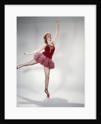 1960s awkward teen girl red velvet costume pink net tutu attempting arabesque en pointe by Anonymous
