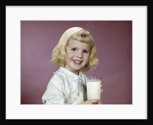 1960s girl glass milk dairy smile looking at camera by Anonymous