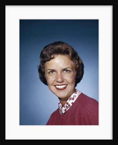 1960s portrait smiling brunette woman wearing red sweater looking at camera by Anonymous
