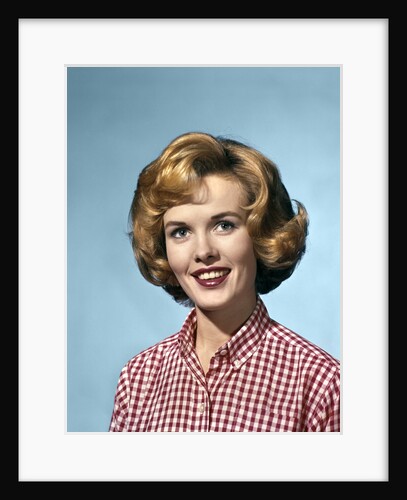 1960s portrait smiling blond woman wearing a red white checked blouse by Anonymous