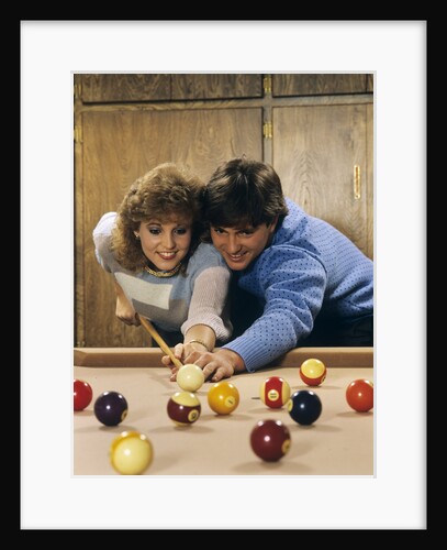 1980s teen couple playing pool by Anonymous