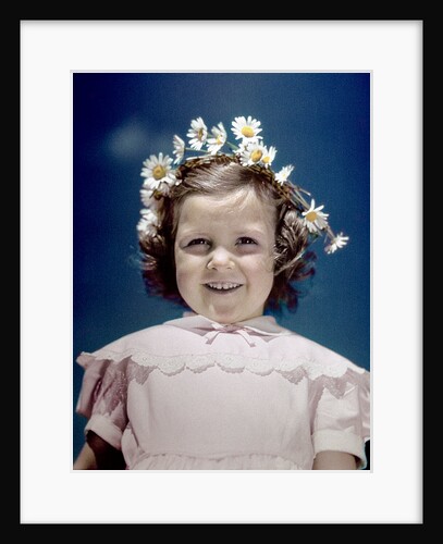1940s portrait smiling little girl wearing yellow and white crown of daisy flowers by Anonymous