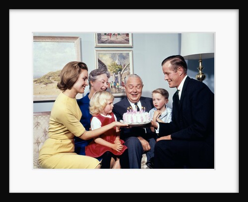1960s three generation family with birthday cake by Anonymous