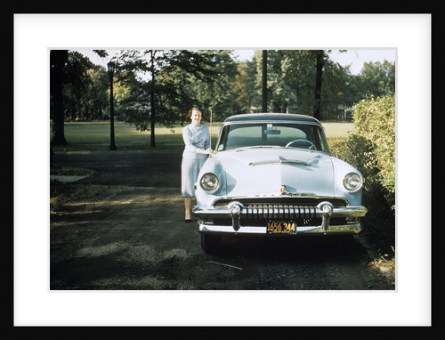 1950s 1955 woman standing beside 1954 mercury automobile by Anonymous