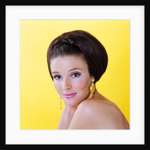 1960s glamorous young woman brunette big hair teased bouffant hairstyle by Anonymous
