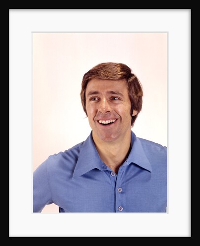1970s man portrait head shoulders blue shirt laughing toothy smile by Anonymous