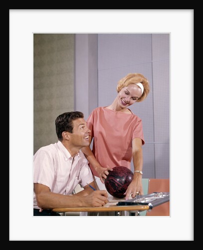 1960s couple husband wife bowling checking the score indoor by Anonymous