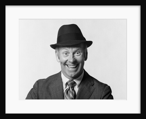 1960s man smiling wearing suit and hat with silly eager facial expression by Anonymous