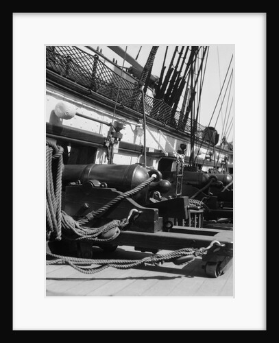 1930s row of cannon breeches on gun deck of sailing naval ship of war by Anonymous