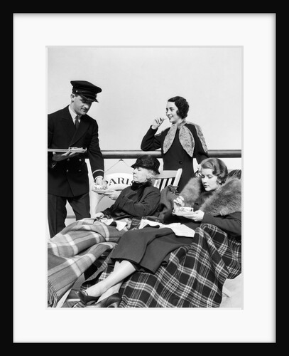 1930s 1920s three women being served tea by a steward on board an ocean liner crossing the atlantic ocean by Anonymous