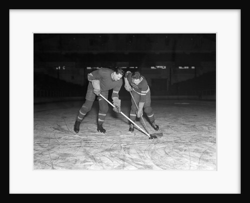 1940s 1950s ice hockey players fighting for the puck by Anonymous