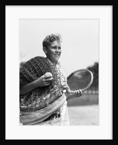 1920s 1930s boy tennis player holding racket net and ball by Anonymous