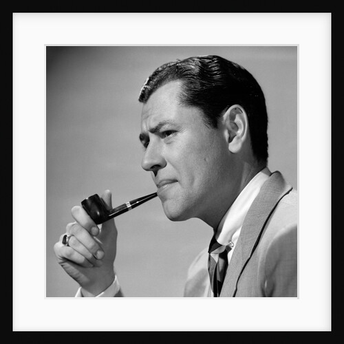 1950s frowning businessman in jacket and tie smoking a pipe by Anonymous
