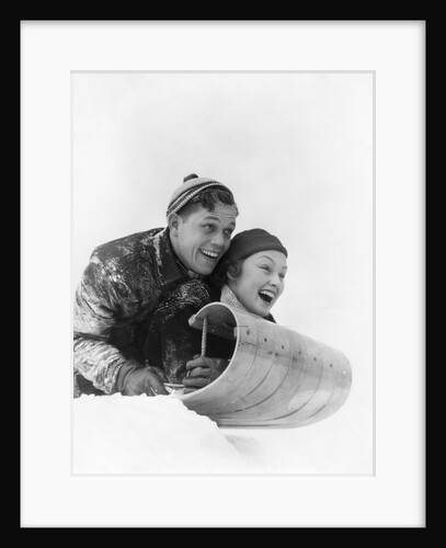 1930s couple on toboggan laughing by Anonymous
