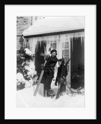 1940s 1930s mother son standing holding skis in front of winter house with icicles by Anonymous