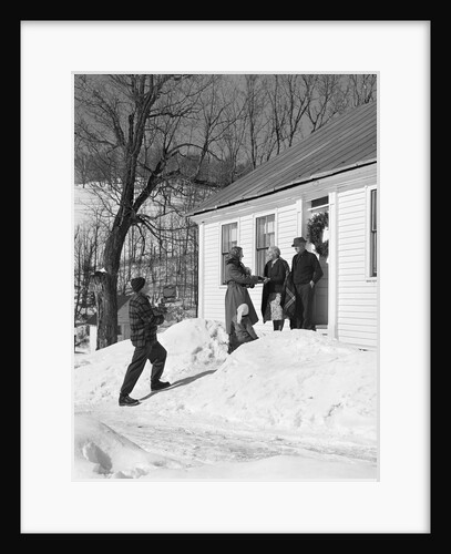 1950s family visiting relatives at christmas being greeted at front door by Anonymous