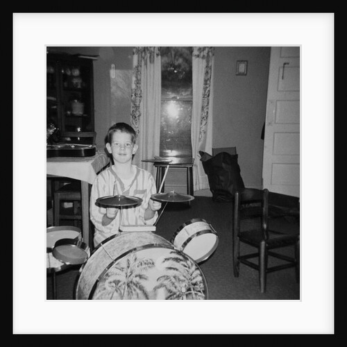 Ten year old boy on drum set, ca. 1969. by Anonymous