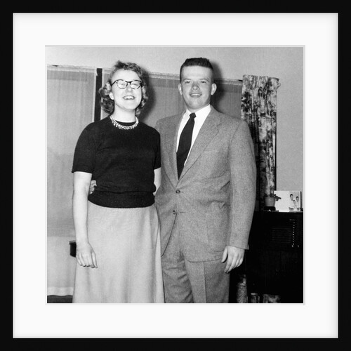 Young newlyweds smile for a portrait, ca. 1956. by Anonymous
