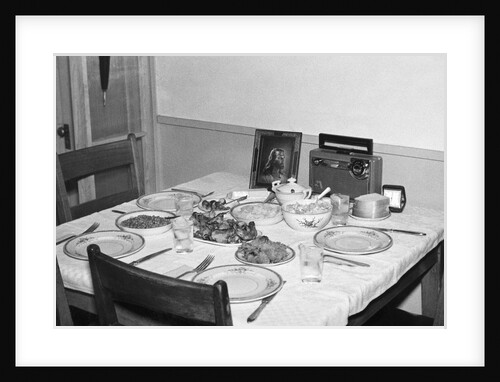 Jesus watches over the dinner table, ca. 1956. by Anonymous
