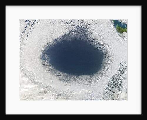 Cloud hole caused by intense high pressure system by Anonymous