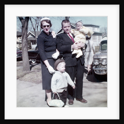Young family dressed in the Sunday best, ca. 1960. by Anonymous