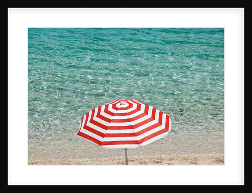 Close up of striped beach umbrella near sea, San Vito lo Capo, Sicily, Italy by Anonymous