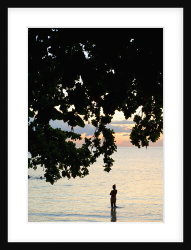 Silhouette of woman wading at sea at sunset, Anse l' Islette, Seychelles, Indian Ocean islands by Anonymous