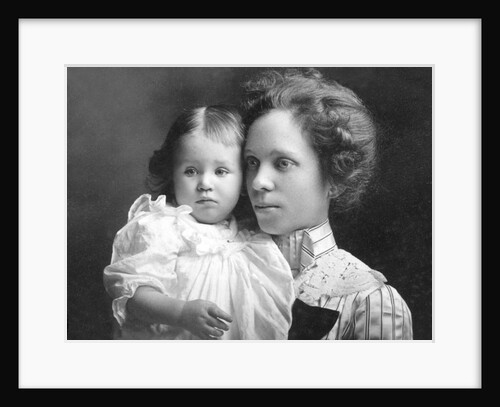 Young mother with her toddler son, ca. 1913 by Anonymous