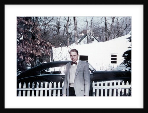 Mature man in front of 1940s car, ca. 1950 by Anonymous