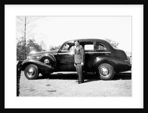 Mature man with his new automobile, ca. 1940 by Anonymous