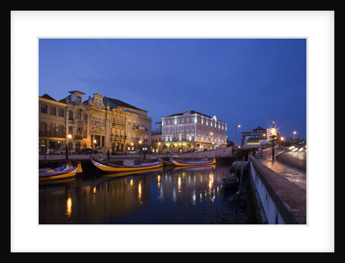 Moliceiro boats docked by Art Nouveau style buildings along the Central Canal by Anonymous