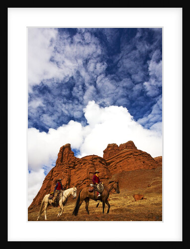 Riders passing under the Red Rock Hills of the Big Horn Mountains by Anonymous