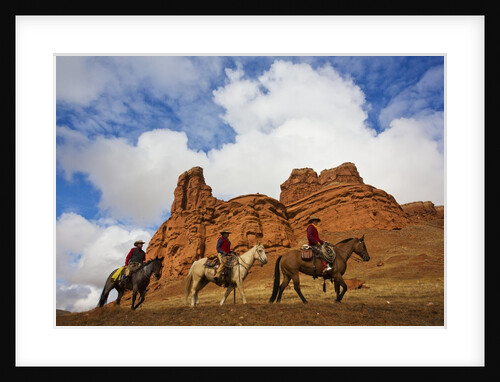 Riders passing under the Red Rock Hills of the Big Horn Mountains by Anonymous