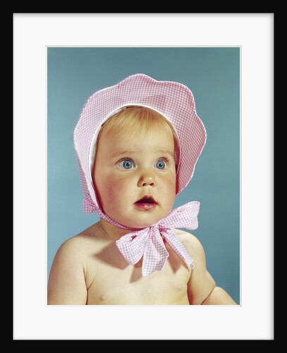 1960s Very Cute Blond Blue Eyed Baby Wearing Red White Checked Bonnet Tied In Bow At Chin by Anonymous