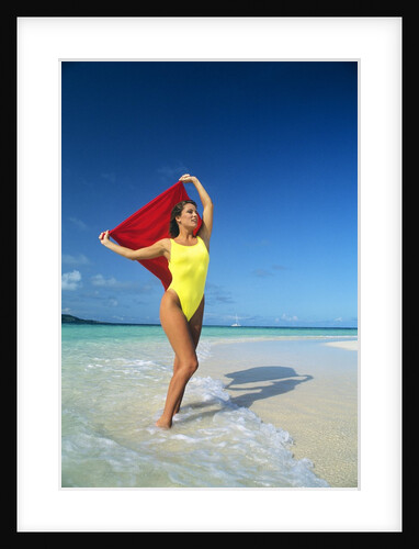 1980s Woman Wearing Yellow Bathing Suit Holding Red Cloth Mopion Island Grenadines West Indies by Anonymous