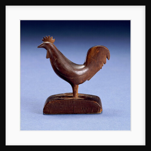 A carved figure of a rooster by Anonymous