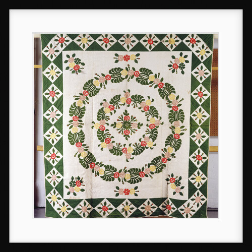 A pieced and appliqued cotton quilted coverlet by Anonymous