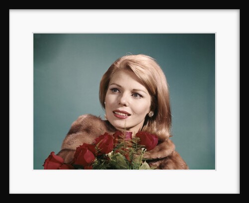 1960s Blond Woman Wearing Fur Coat Holding Bunch Of Red Roses by Anonymous