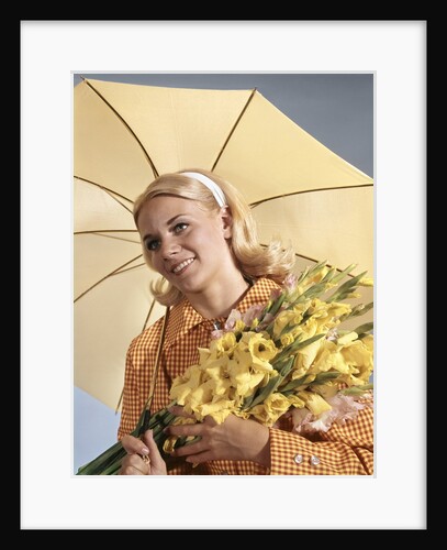1960s Smiling Blond Woman Umbrella Holding Bouquet Yellow Gladiolas by Anonymous