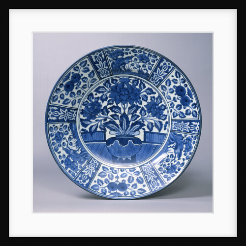 A fine Arita blue and white charger with peony sprays on on veranda by Anonymous