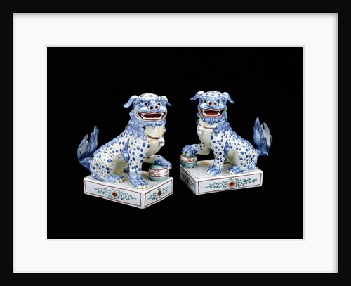 A pair of Kakiemon models of seated Karashishi by Anonymous